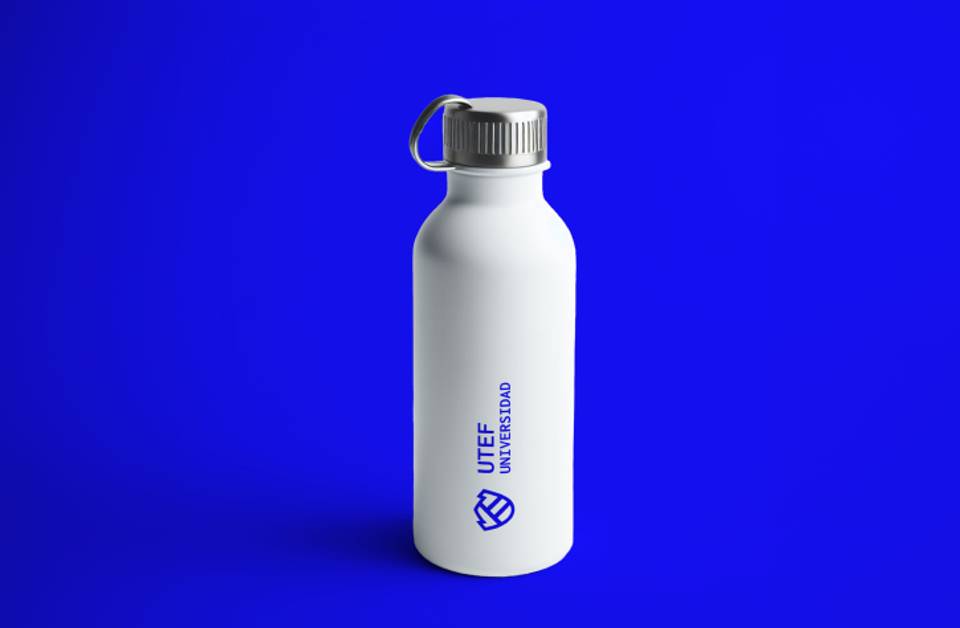 A white reusable water bottle with a logo, placed against a blue background.