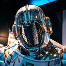 Close-up of a futuristic robot suit with intricate details and blue highlights.