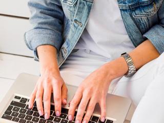 high-angle-woman-working-laptop.jpeg